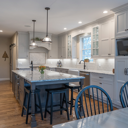 Farmhouse kitchen with blue island, white cabinets and Windsor dining chairs