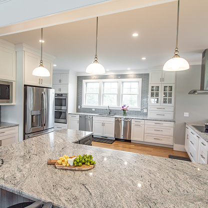 Contemporary kitchen with granite island, pendant lighting, stainless steel appliances and white shaker cabinets - open concept
