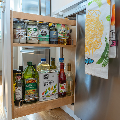 Pull-out pantry organizer with cooking oils and condiments - modern kitchen storage solutions