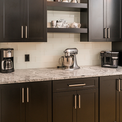 Coffee bar with dark shaker cabinets, granite countertops, and stainless steel appliances